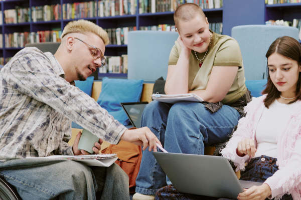 College students in library collaborating.