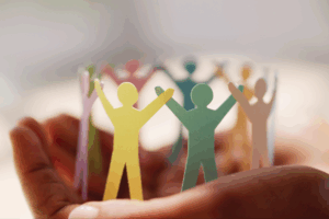 Paper cutouts of team members representing leadership.