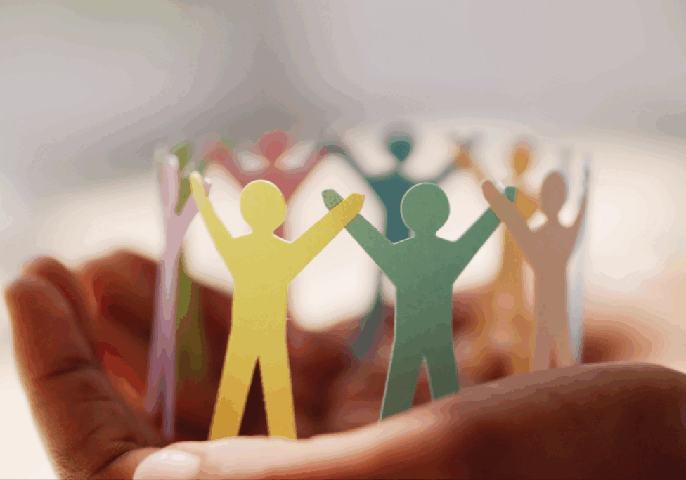 Paper cutouts of team members representing leadership.